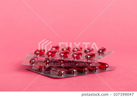 too many different pill cartridges stacked. selective Focus. Packs of blister pills with tablets. Colored pastilles packages. A pile of medicine in blister packs. Pharmaceutical blister packs too many different pill cartridges stacked. selective Focus. Packs of blister pills with tablets. Colored pastilles packages. A pile of medicine in blister packs. Pharmaceutical blister packs 107399047