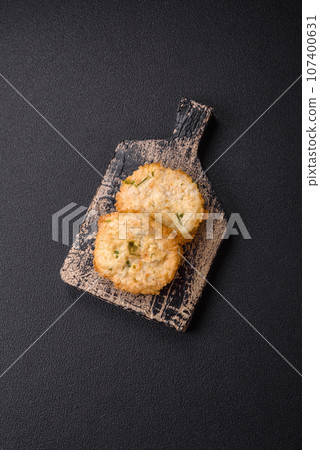 Delicious fried minced fish cutlets or meatballs with salt, spices and herbs 107400631