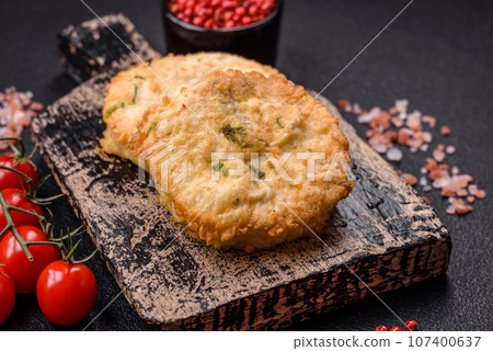 Delicious fried minced fish cutlets or meatballs with salt, spices and herbs Delicious fried minced fish cutlets or meatballs with salt, spices and herbs 107400637