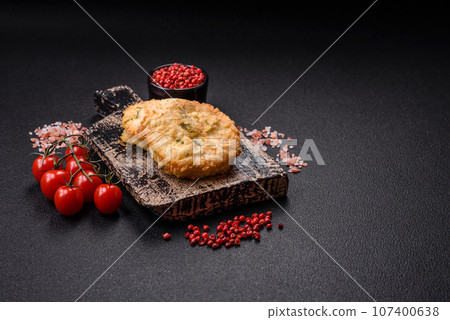 Delicious fried minced fish cutlets or meatballs with salt, spices and herbs 107400638