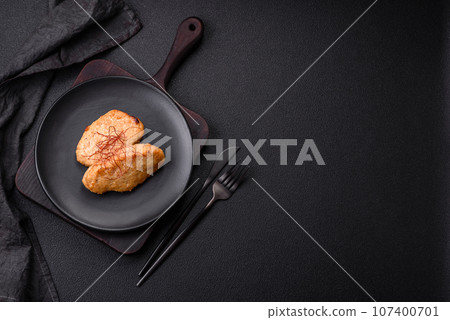 Delicious fried cutlets or meatballs with salt, spices and herbs 107400701