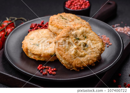 Delicious fried minced fish cutlets or meatballs with salt, spices and herbs Delicious fried minced fish cutlets or meatballs with salt, spices and herbs 107400722