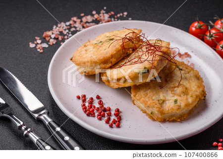 Delicious fried minced fish cutlets or meatballs with salt, spices and herbs Delicious fried minced fish cutlets or meatballs with salt, spices and herbs 107400866