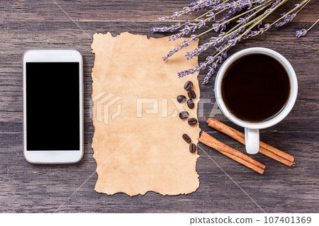 Old paper on dark wooden table background. 107401369