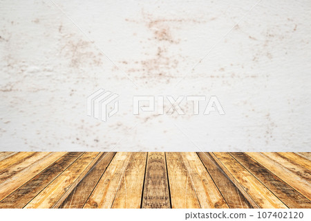 Empty perspective wood plank table top with old cement wall blackground 107402120