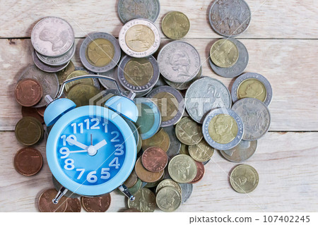 Office desk with money coins and business financial planning concept Office desk with money coins and business financial planning concept 107402245