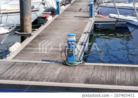 Charging station for boats in the harbor with electrical outlets   107403451