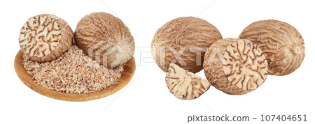 Whole and grated nutmeg in wooden bowl isolated on white background with full depth of field. Whole and grated nutmeg in wooden bowl isolated on white background with full depth of field. 107404651