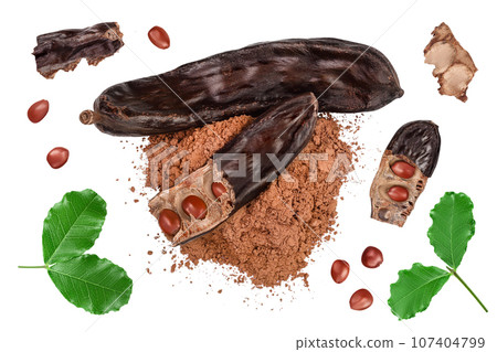 Carob pod and powder isolated on white background with clipping path and full depth of field. Top view. Flat lay 107404799