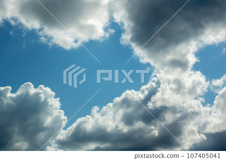 White clouds in bright blue sky closeup 107405041