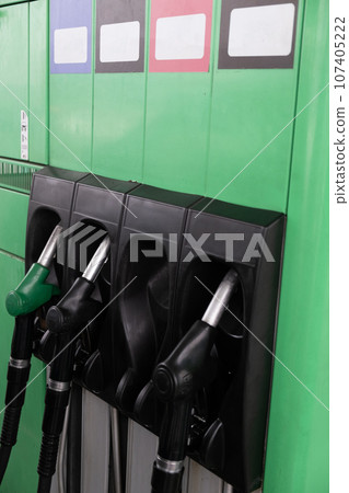 fuel oil gasoline dispenser at petrol filling station 107405222
