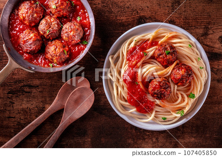 Meatballs. Beef meat balls, overhead flat lay shot in a pan and with spaghetti Meatballs. Beef meat balls, overhead flat lay shot in a pan and with spaghetti 107405850