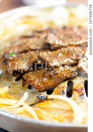 Grill beef on a yakiniku griddle Grill beef on a yakiniku griddle 107406756