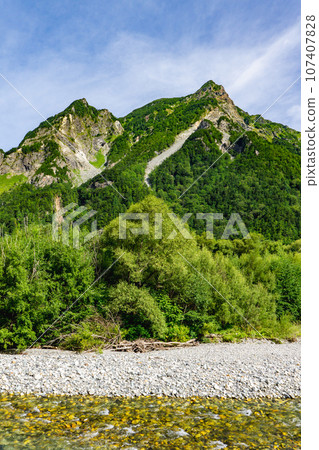 Mt. Myojin in the Northern Alps seen from the promenade in Kamikochi, Nagano Prefecture 107407828