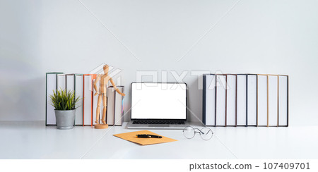 Laptop computer mockup blank white screen on table in white background. laptop with blank screen on table of workplace contemporary white background 107409701