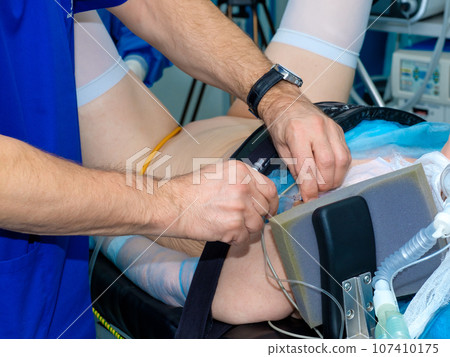 Doctor's hands install a catheter for anesthesia Doctor's hands install a catheter for anesthesia 107410175