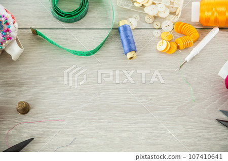 a set of tools and threads for sewing clothes a set of tools and threads for sewing clothes 107410641