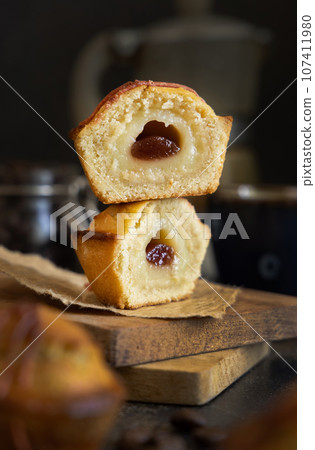 Pasticciotto leccese pastry filled with egg custard cream and sour cherry jam close up 107411980