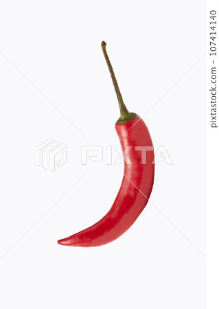 Red crescent-shaped chili pepper on white background Red crescent-shaped chili pepper on white background 107414140