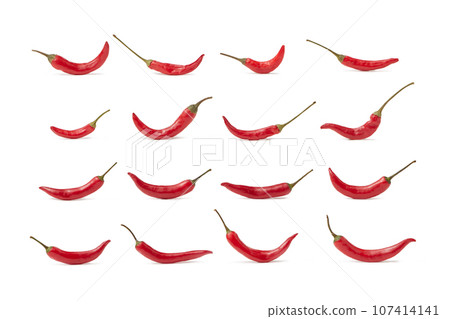 Red hot chili peppers arranged in rows on white background Red hot chili peppers arranged in rows on white background 107414141