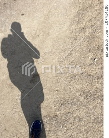 man shadow,human shadow on yellow desert sands man shadow,human shadow on yellow desert sands 107414180
