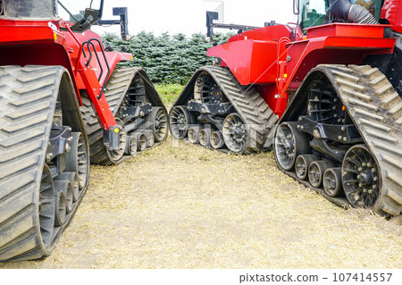 Two off road agricultural machines with triangle rubber crawler suspension, crawler transmission 107414557