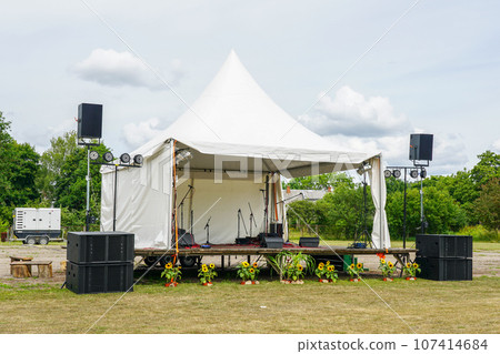 A small stage for outdoor events prepared for the concert, power supply from rental diesel generator 107414684