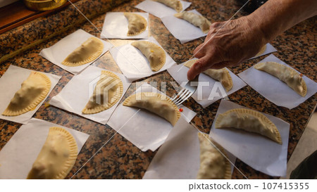 woman making patty woman making patty 107415355
