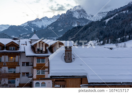 Winter Italy Dolomite village in mountains covered with snow  107415717