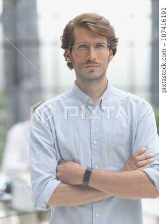 close-up portrait of a young successful businessman in the office close-up portrait of a young successful businessman in the office 107416191