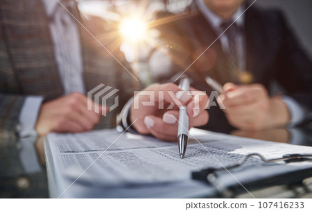 online banking seated at the table planning budget, managing expenses 107416233