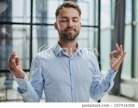 Young worker having break and resting after solving task Young worker having break and resting after solving task 107416300