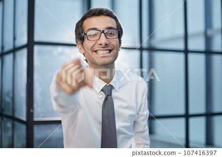 business man points his finger at you business man points his finger at you 107416397