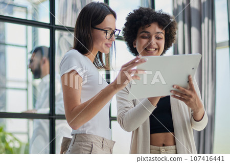 business woman with her staff in background at office business woman with her staff in background at office 107416441