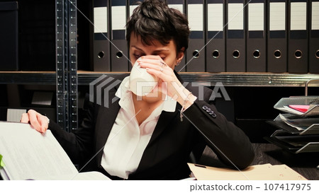 Law agent reviews classified records, conducting investigation into the organized crime case. Private detective undertaking clandestine operation using confidential documents and clues. 107417975