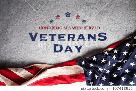 Happy Veterans day concept made from American flag and the text on dark stone background. Happy Veterans day concept made from American flag and the text on dark stone background. 107418935