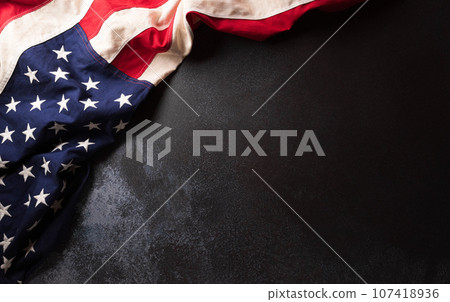 Happy Veterans day concept made from American flag on dark stone background. Happy Veterans day concept made from American flag on dark stone background. 107418936