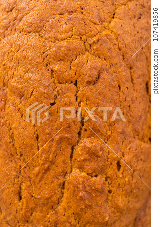 Sliced homemade pumpkin bread on a white cutting board. Sliced homemade pumpkin bread on a white cutting board. 107419856