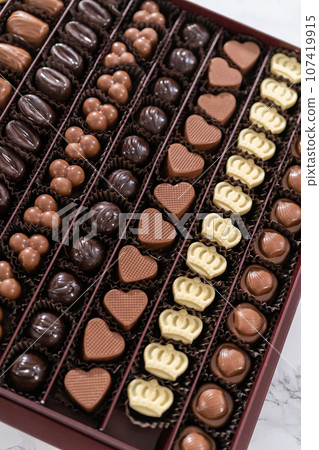 Box of gourmet assorted chocolates ina large box. Box of gourmet assorted chocolates ina large box. 107419915