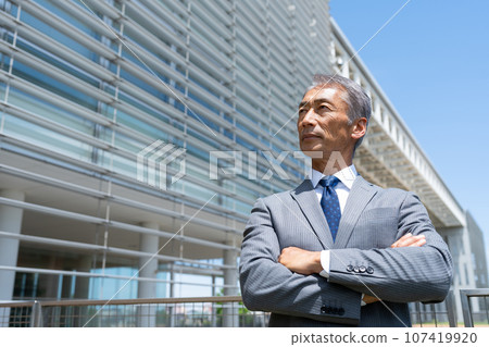 Senior man with arms folded 107419920