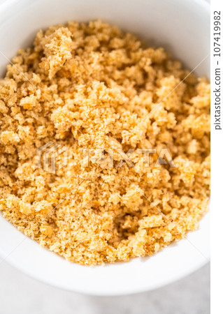 Freshly dried bread crumbs in a white bowl. Freshly dried bread crumbs in a white bowl. 107419982