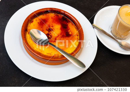 Sweet custard crema catalana with caramelized sugar crust Sweet custard crema catalana with caramelized sugar crust 107421330