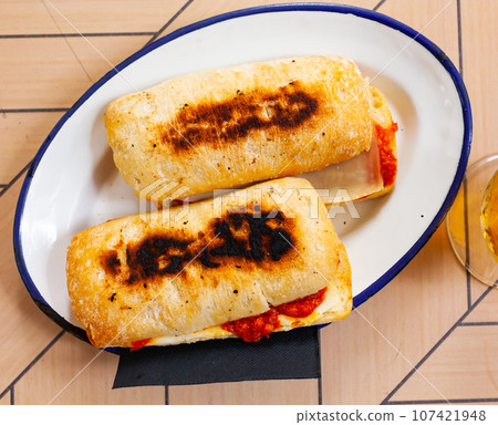 Hot homemade sandwich with chorizo and cheese 107421948