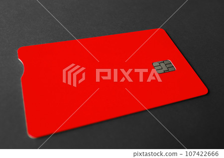 Green plastic bank card on a gray background. Mockup. Plastic card with chip. 107422666
