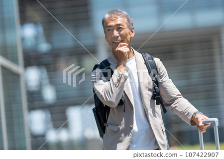 Senior man with carry bag Senior man with carry bag 107422907