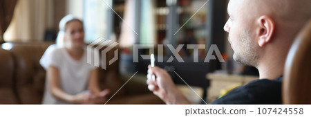 Careful psychologist listens to woman patient in office Careful psychologist listens to woman patient in office 107424558