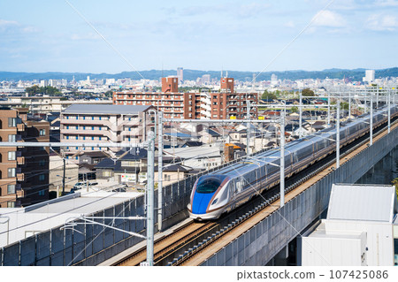 Image of the Hokuriku Shinkansen departing from Hakusan General Depot and heading towards Kanazawa Station | Hakusan City, Ishikawa Prefecture Image of the Hokuriku Shinkansen departing from Hakusan General Depot and heading towards Kanazawa Station | Hakusan City, Ishikawa Prefecture 107425086