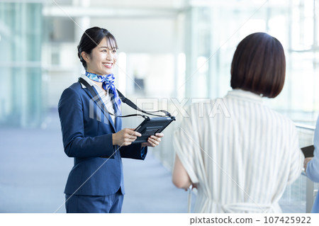 Airport ground staff guiding Airport ground staff guiding 107425922