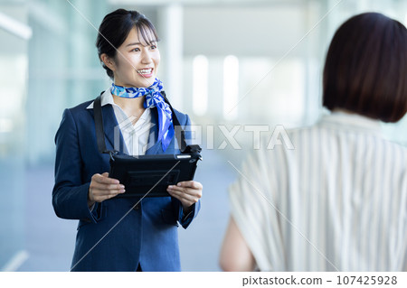 Airport ground staff guiding Airport ground staff guiding 107425928