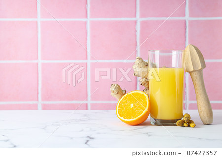 Concept of healthy liquid - ginger turmeric drink Concept of healthy liquid - ginger turmeric drink 107427357